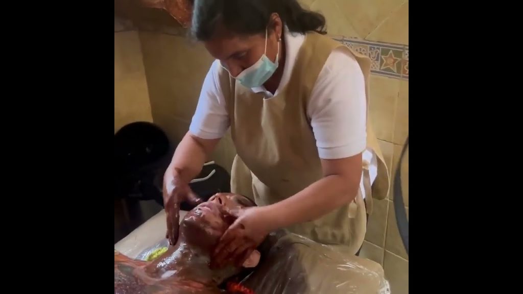 6ix9ine recieving a chocolate massage in Ecuador